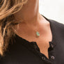 Model wearing aqua blue chalcedony necklace with 16" 12kt gold fill chain
