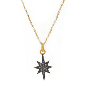 Diamond 8 pointed star charm on gold vermeil chain.