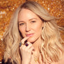 Portrait of Jewel modeling rings including an adjustable pyrite stone ring in zero carat gold alchemia.