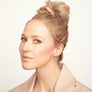 Jewel in an updo modeling long gold vermeil organic oval earrings with blue chalcedony drops