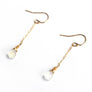 Faceted rainbow moonstones on gold fill chain dangling earrings.