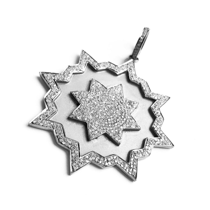 Pave diamond 8 point bursting star pendant in sterling silver