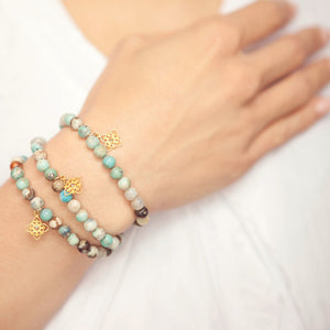 Three blue jasper bead Inspiration bracelets on Jewel's wrist