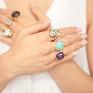 Jewel's hands adorned with rings from her handmade jewelry collection Songlines by Jewel