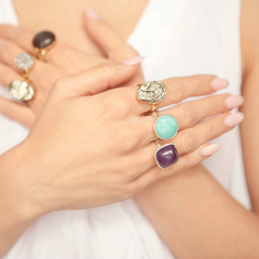 Jewel's hands adorned with rings from her handmade jewelry collection Songlines by Jewel