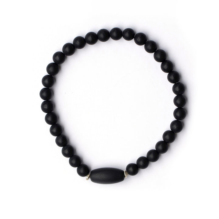 Black jade bead bracelet with sterling silver accents on white backdrop